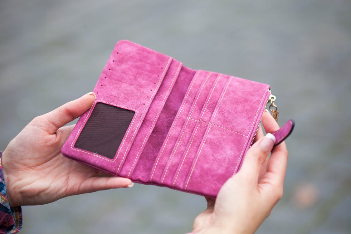 Free Person Holding Pink Suede Long Waller Stock Photo