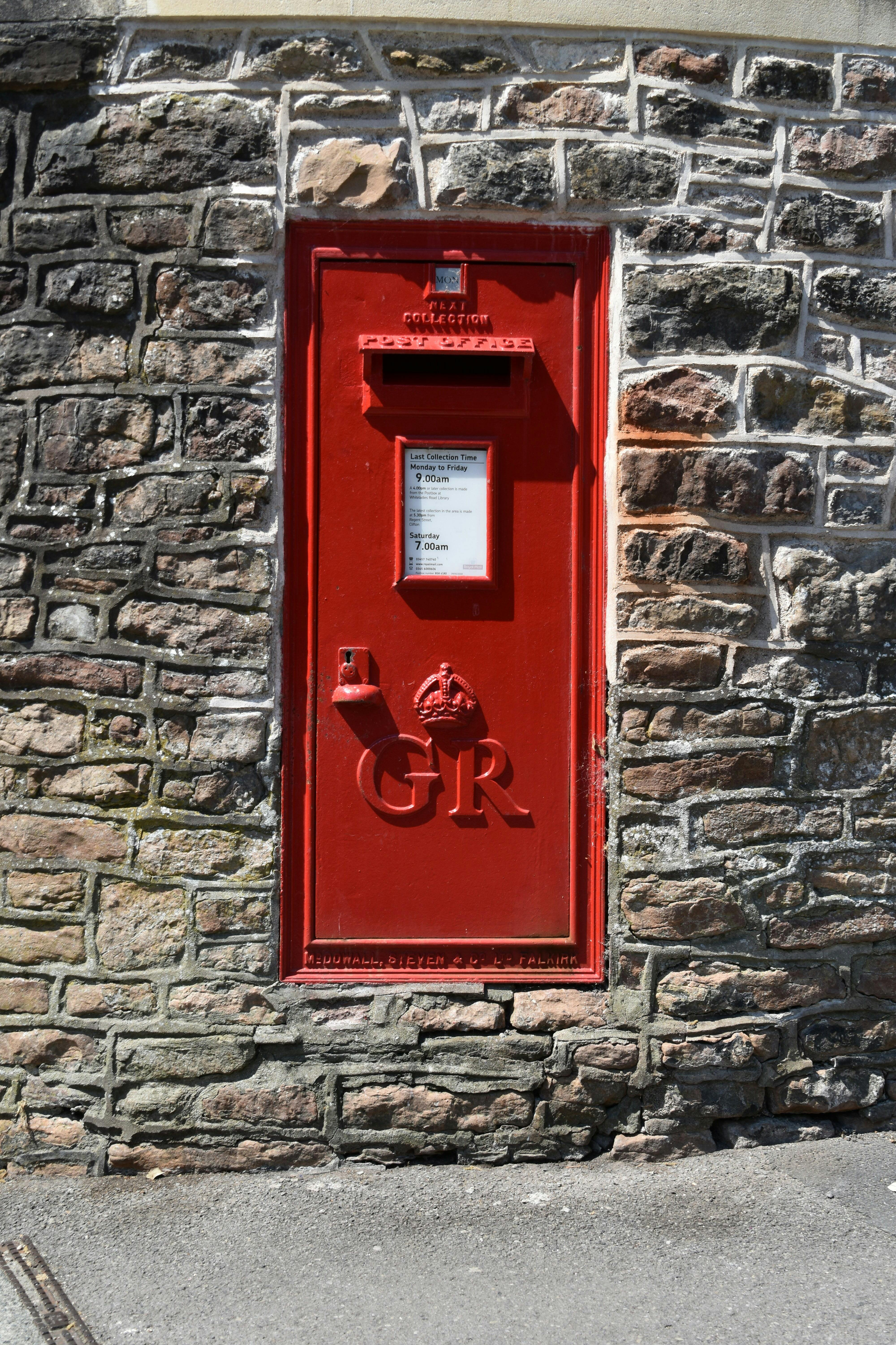 a red door on a brick wall