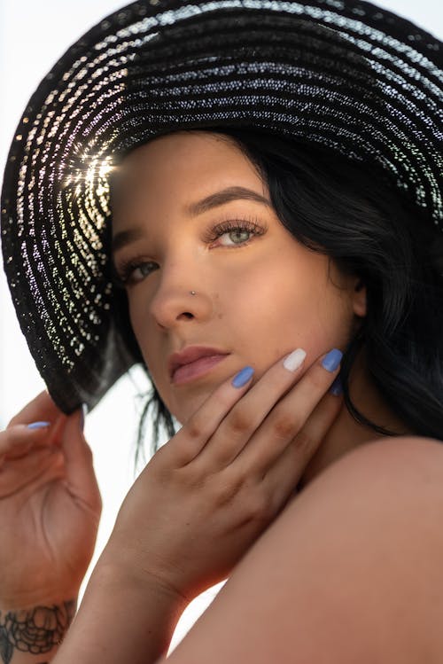 Portrait of a Beautiful Woman Wearing Sun Hat