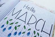 Hello March Printed Paper on White Surface