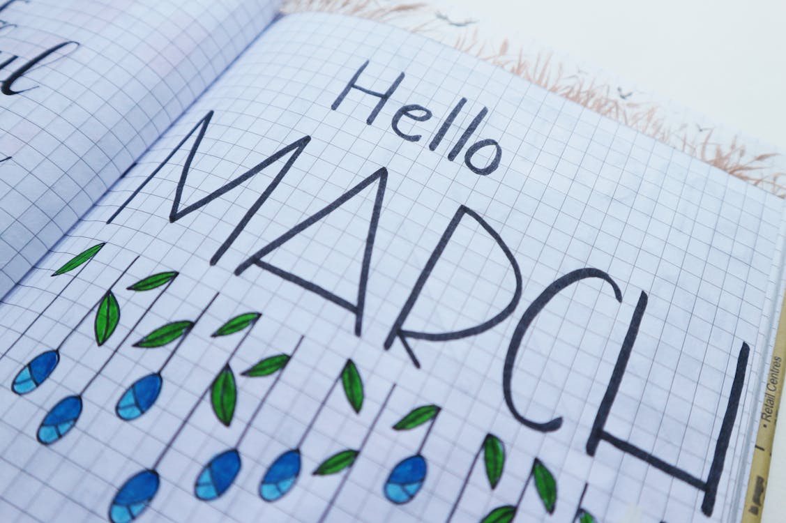 Free Hello March Printed Paper on White Surface Stock Photo