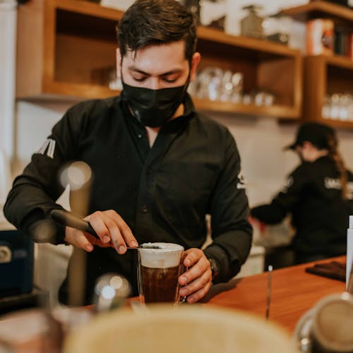 Free A Barista Making a Drink Stock Photo