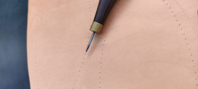 Stitching Awl on Leather Sheet