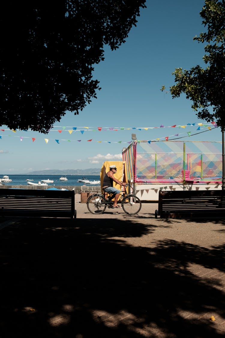 Man Riding Bicycle Near Sea