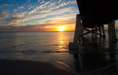 Fotos de stock gratuitas de costero, embarcadero, puesta de sol