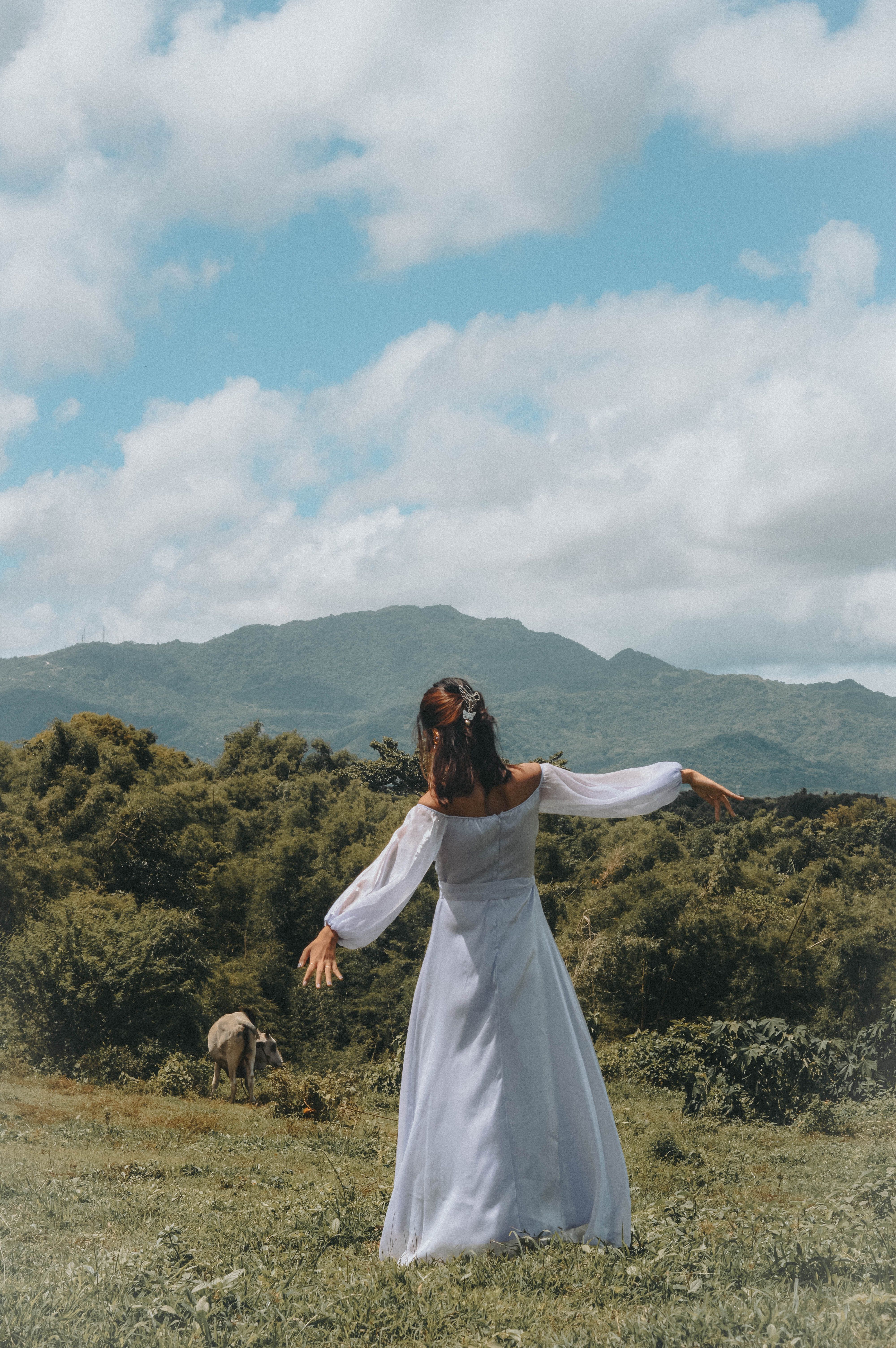 Woman in White Dress Standing on Green Grass Field · Free Stock Photo