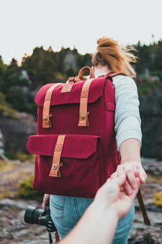 Young woman leading the way on a scenic hike, showcasing adventure and exploration.
