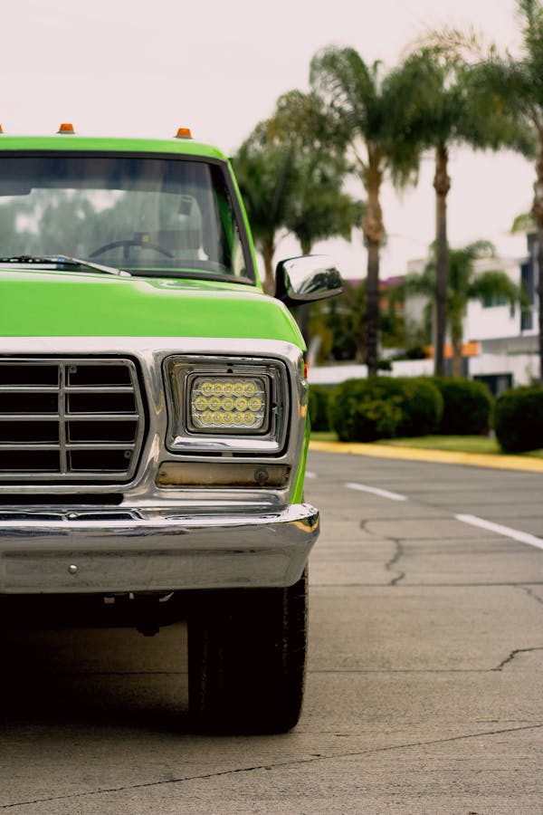 A Close-Up Shot of a Green Ford F-150 on the Road