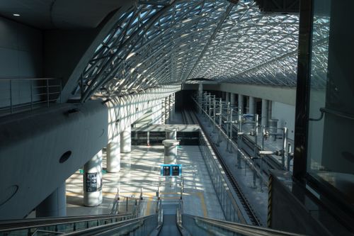Free Modern train station in Seoul with steel architecture and light play on escalator. Stock Photo