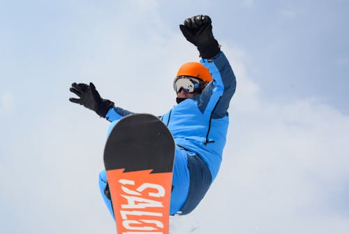 Free Man on a Snowboard Stock Photo