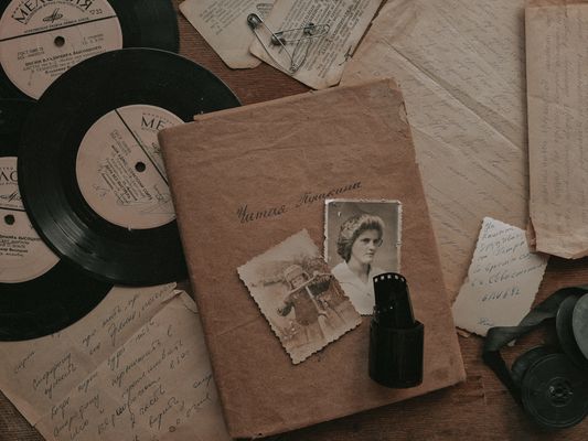 A nostalgic still life with vintage records, photos, and letters, evoking memories from the past