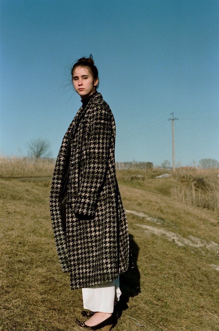 A Woman Wearing A Tweed Coat