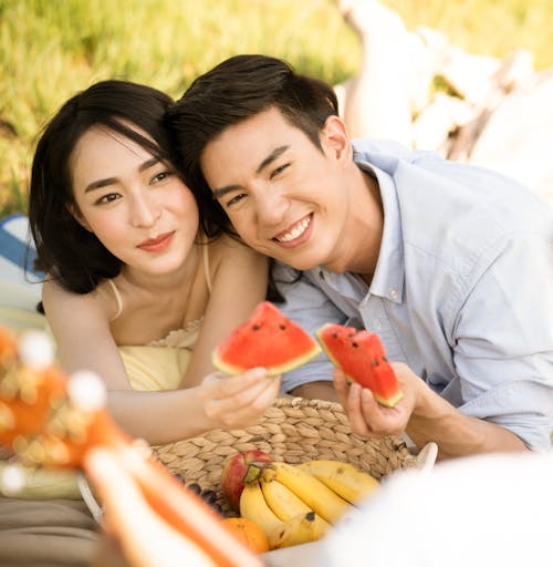 Free Couple Holding Slices of Watermelon Stock Photo