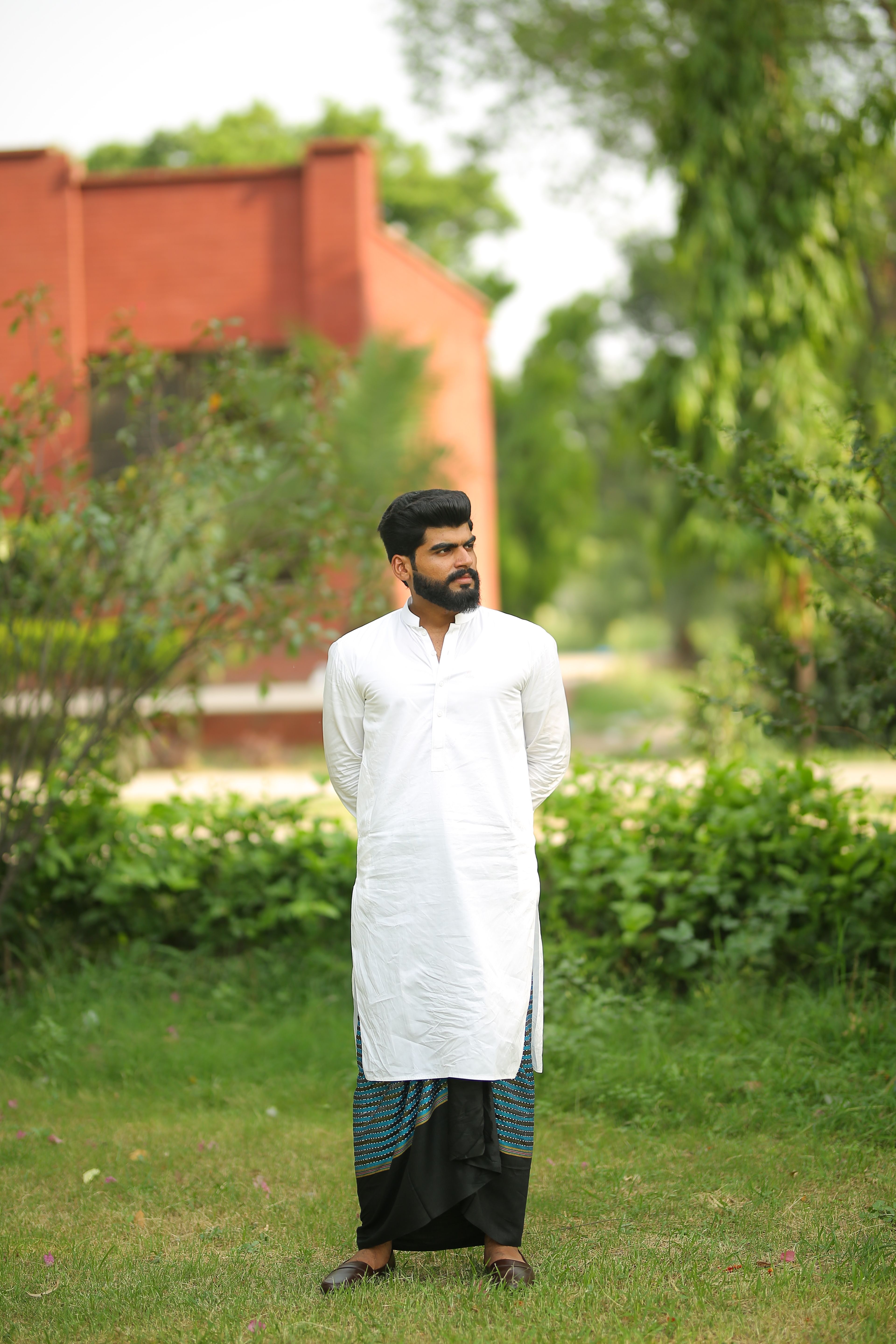 A Bearded Man Wearing a Traditional Clothing · Free Stock Photo