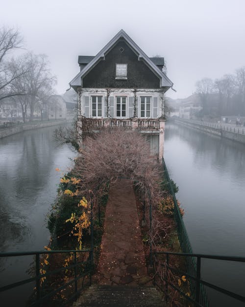 Fog over House on Pond