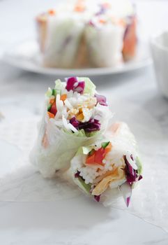 Delicious vegan Vietnamese spring rolls filled with fresh vegetables and rice noodles, ready to eat.