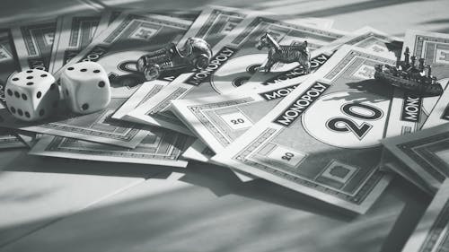 Monochrome Photo of Monopoly Items 
