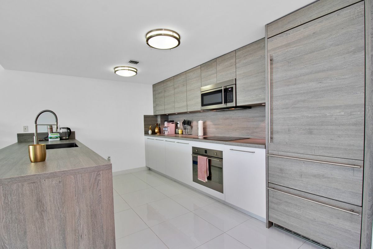 Refined renovated Miami home interior with natural light and tailored furnishings
