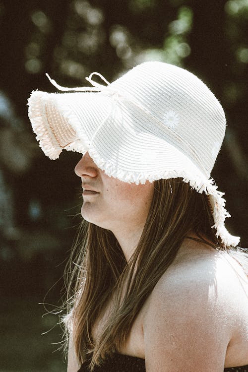 A Woman Wearing a White Hat