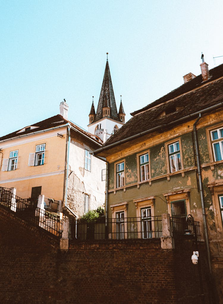 Church Tower Above City Buildings