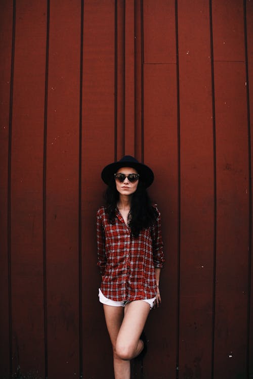 Woman in Plaid Shirt and Black Hat