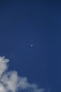 The Moon Across the Blue Sky