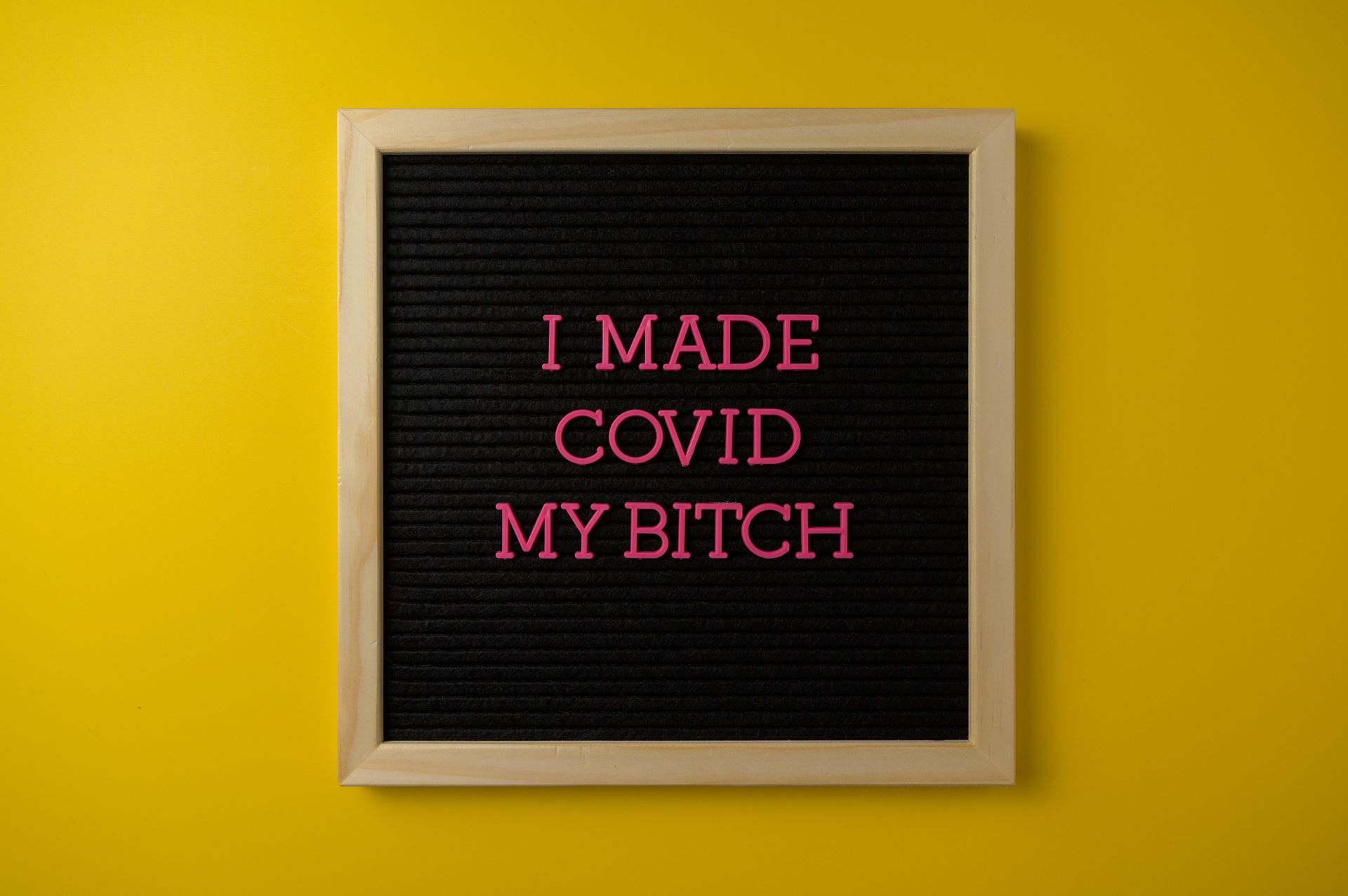 Strong message on a board symbolizing overcoming COVID-19 challenges with vibrant colors.