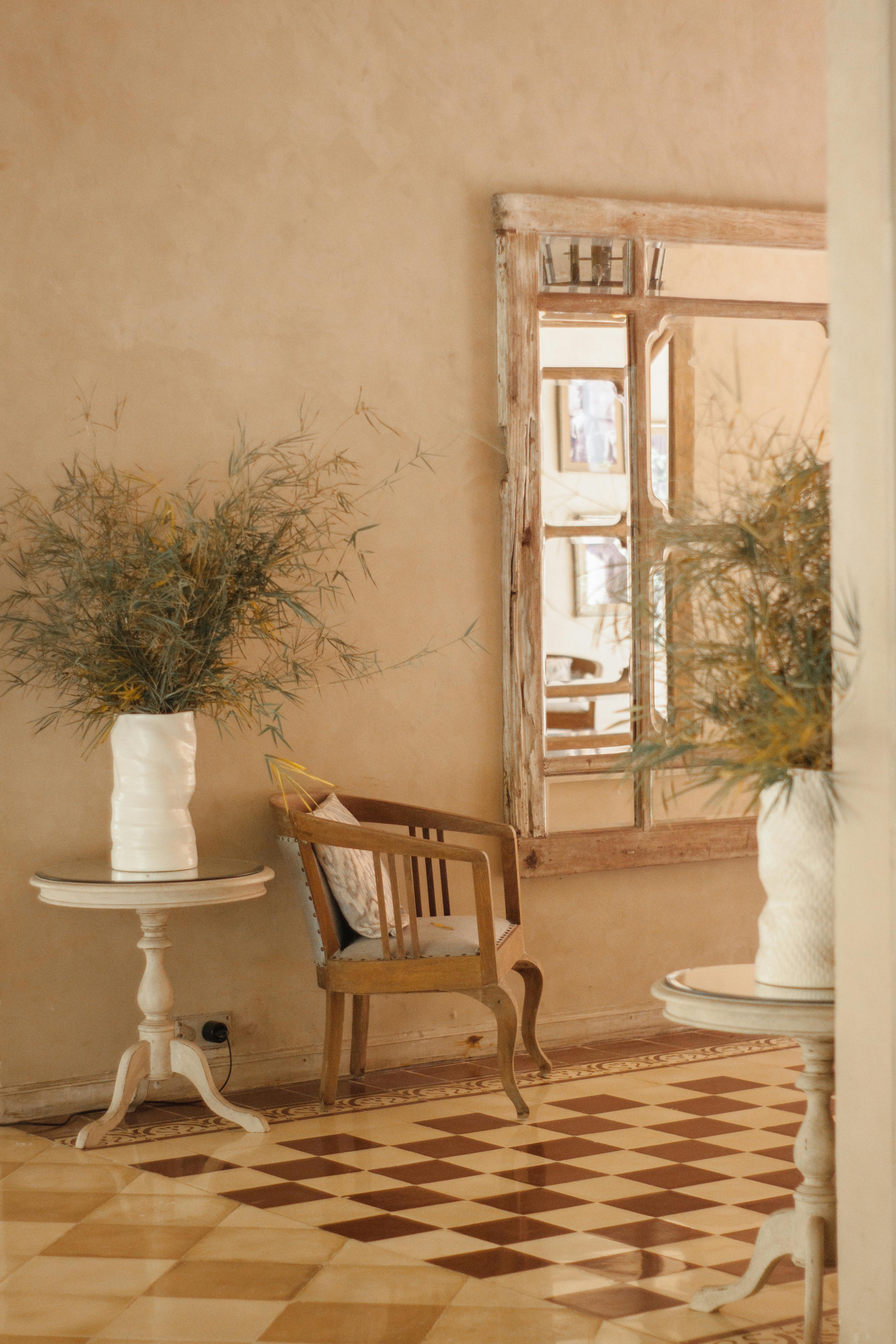 Cozy rustic interior featuring a vintage armchair and classic wooden decor.