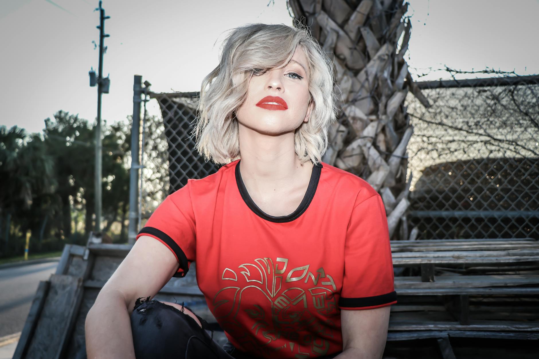 Woman with platinum white hair styled in loose waves showing the icy, dimensional quality of properly toned white hair