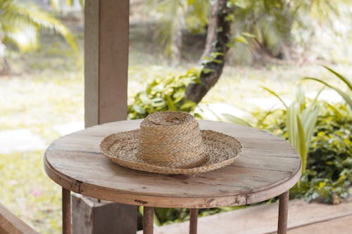 A Woven Hat on a Wooden Table