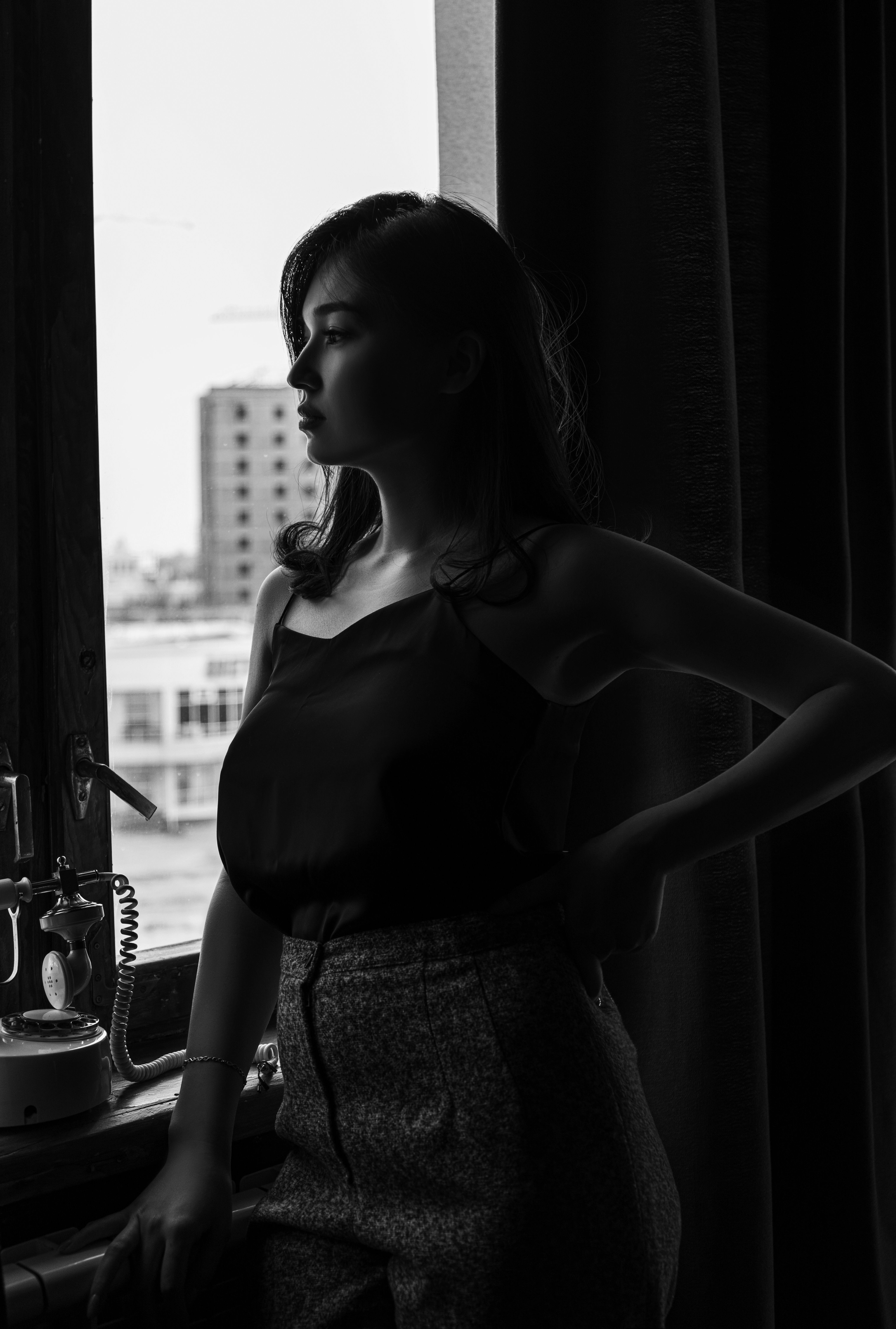 Beautiful Woman Standing Beside the Window · Free Stock Photo