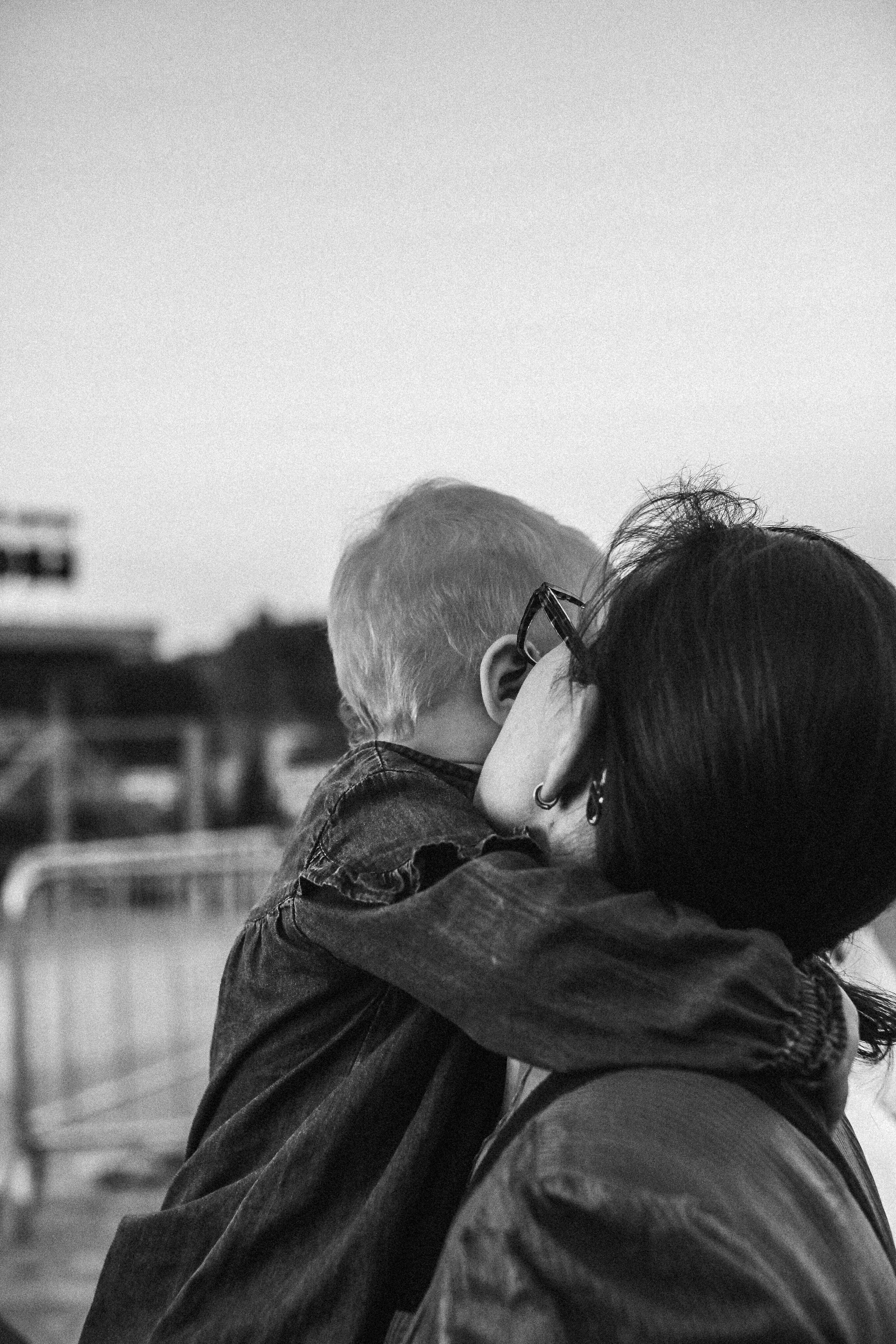 Grayscale Photography of Mother and Child