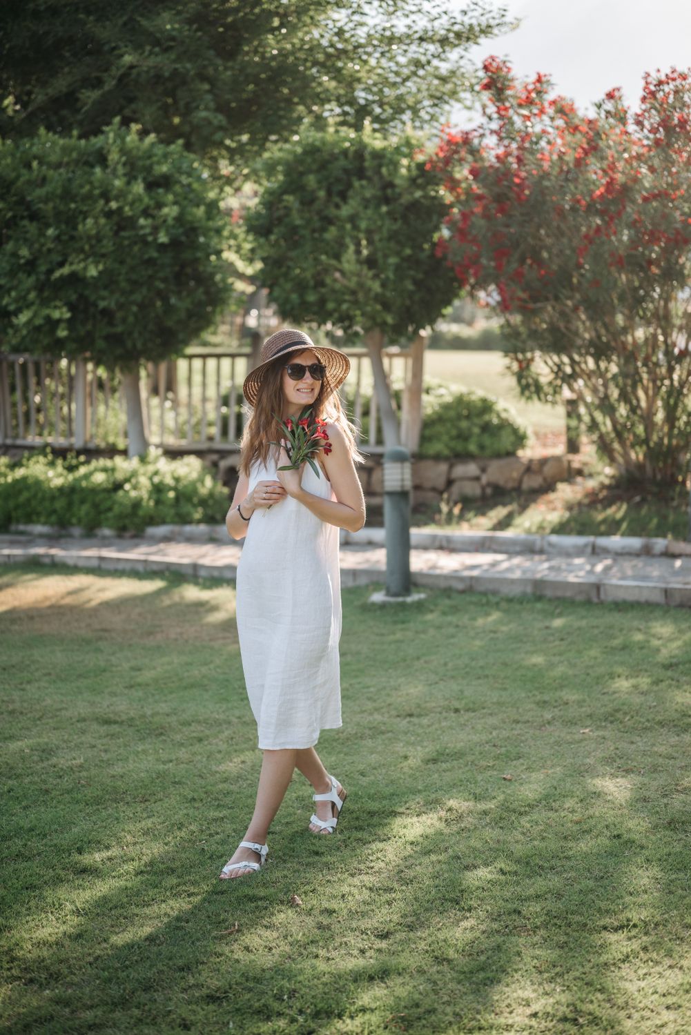 A Woman in White Dress Standing on the Grass · Free Stock Photo