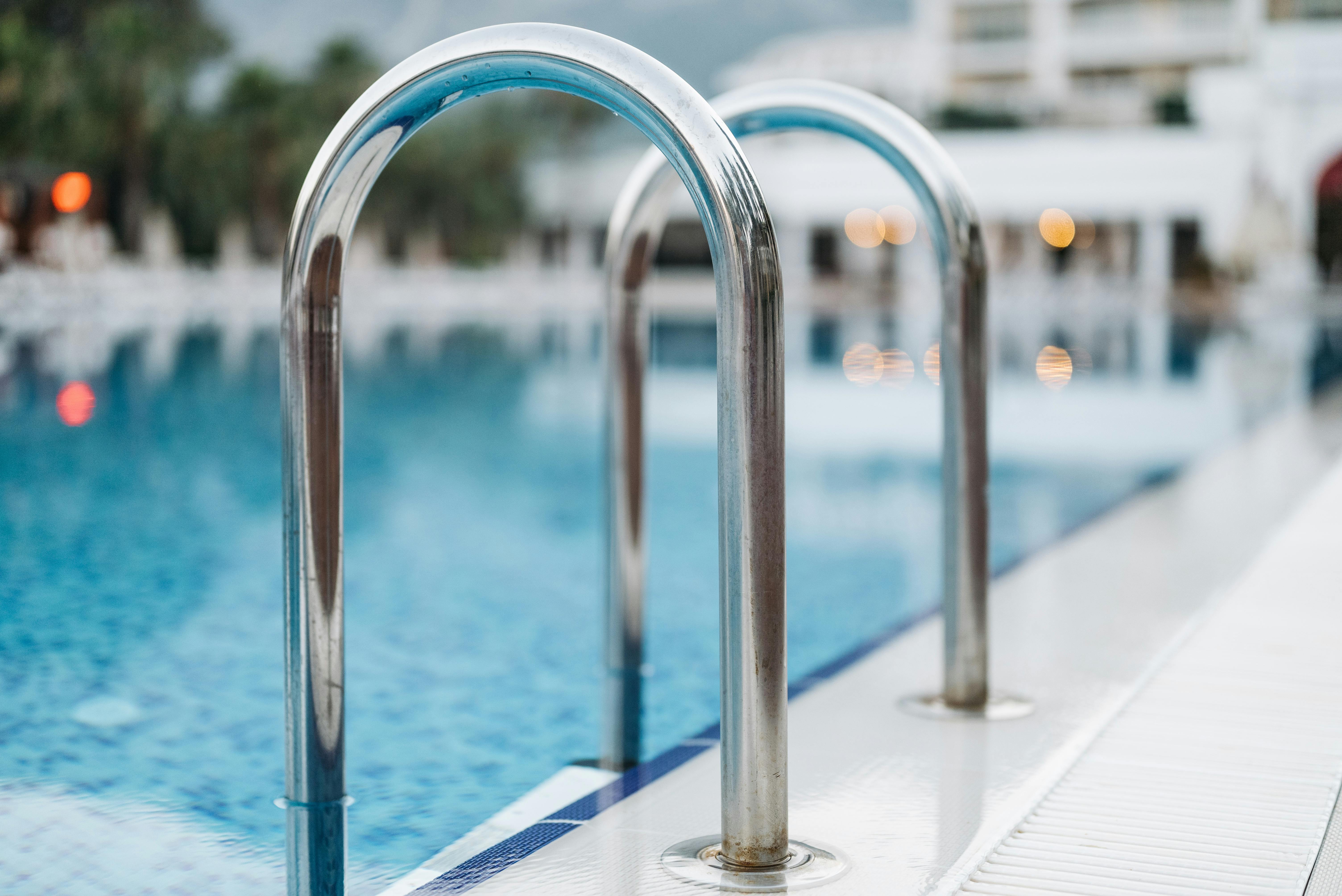 Stainless Steel Pool Railings in Close Up Photography · Free Stock Photo