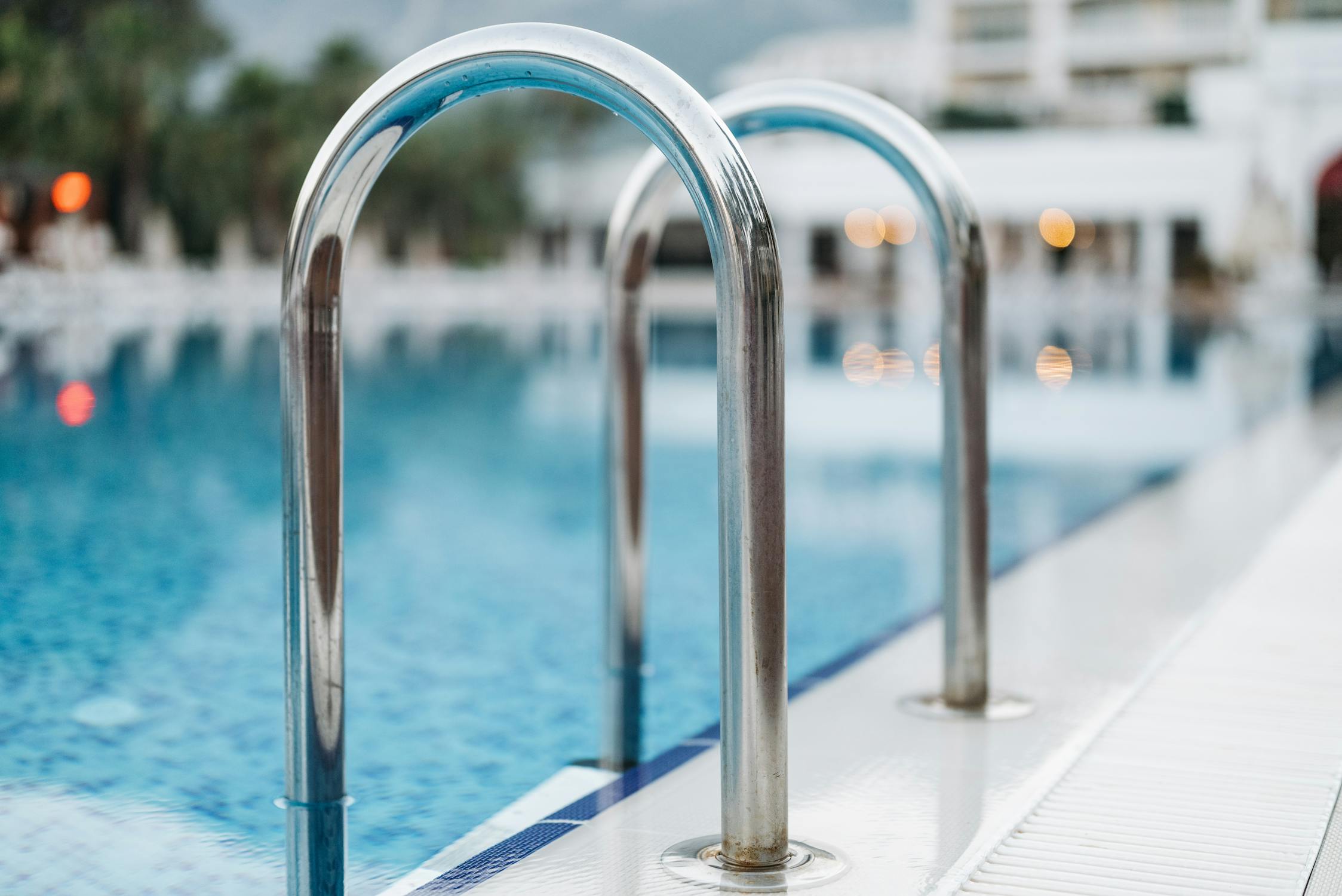 Stainless Steel Pool Railings in Close Up Photography · Free Stock Photo
