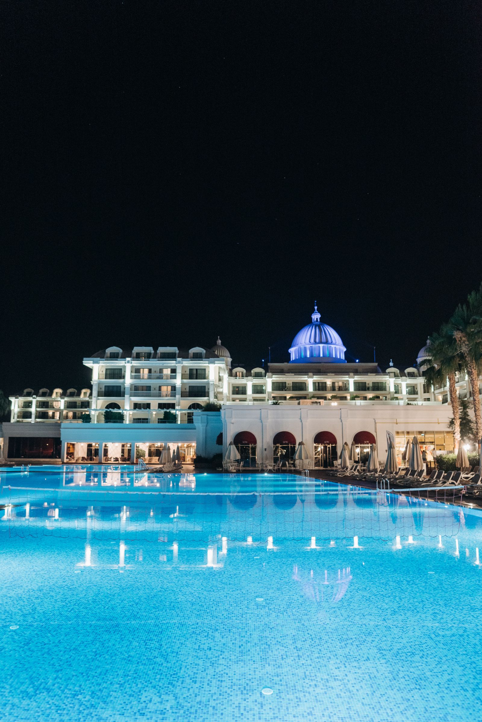 Grand Roll's illuminated tower and pool deck at night
