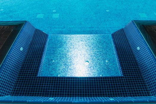 A Swimming Pool With Blue and White Tiles