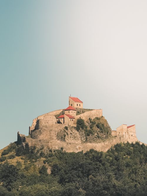 Free Stunning view of Rupea Citadel in Transylvania, showcasing historical architecture atop a lush hill. Stock Photo