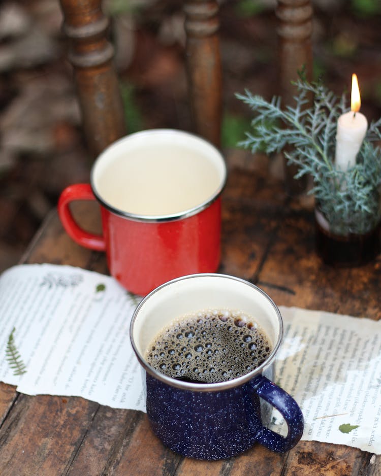 Black Coffee With Bubbles On Blue Mug