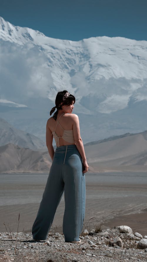 Woman in Blue Wide Pants Standing on the Ground