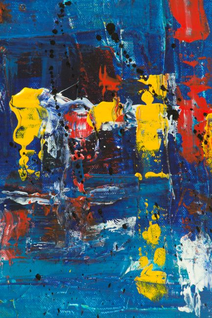 Dynamic abstract acrylic painting with vivid blues, yellows, and reds, showcasing bold expressionism.