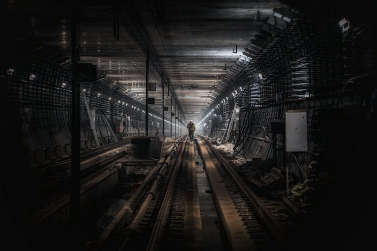 An Under Construction Train Tracks In A Tunnel