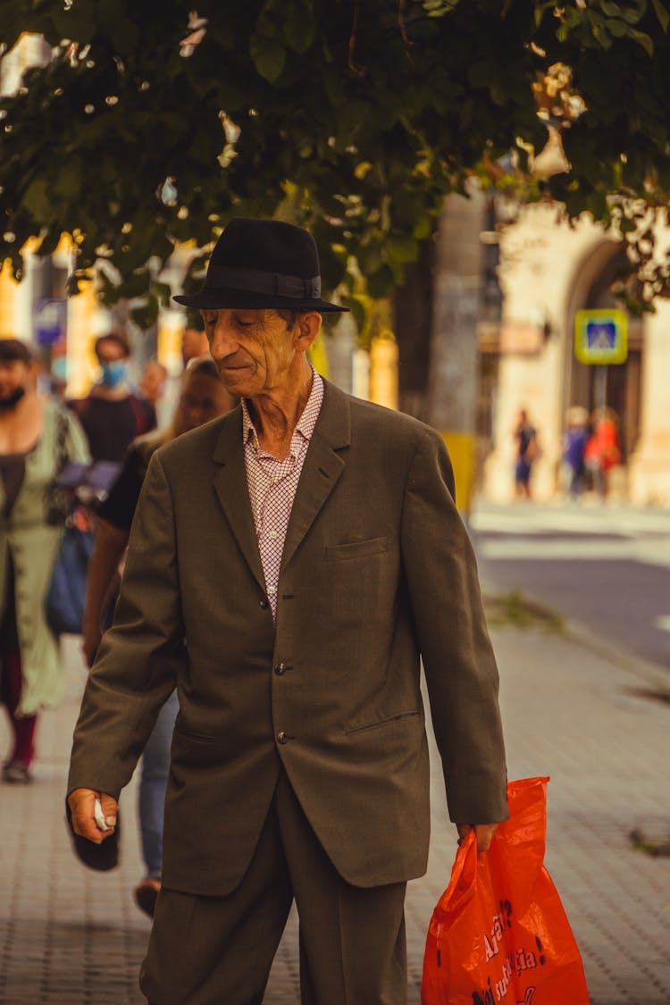 Old Man In Suit Walking City Street