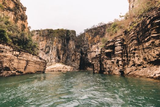 Brown Rocky Mountains Beside Body of Water