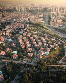 Stunning aerial view of cityscape showcasing residential and urban landscapes in Turkey at sunset.