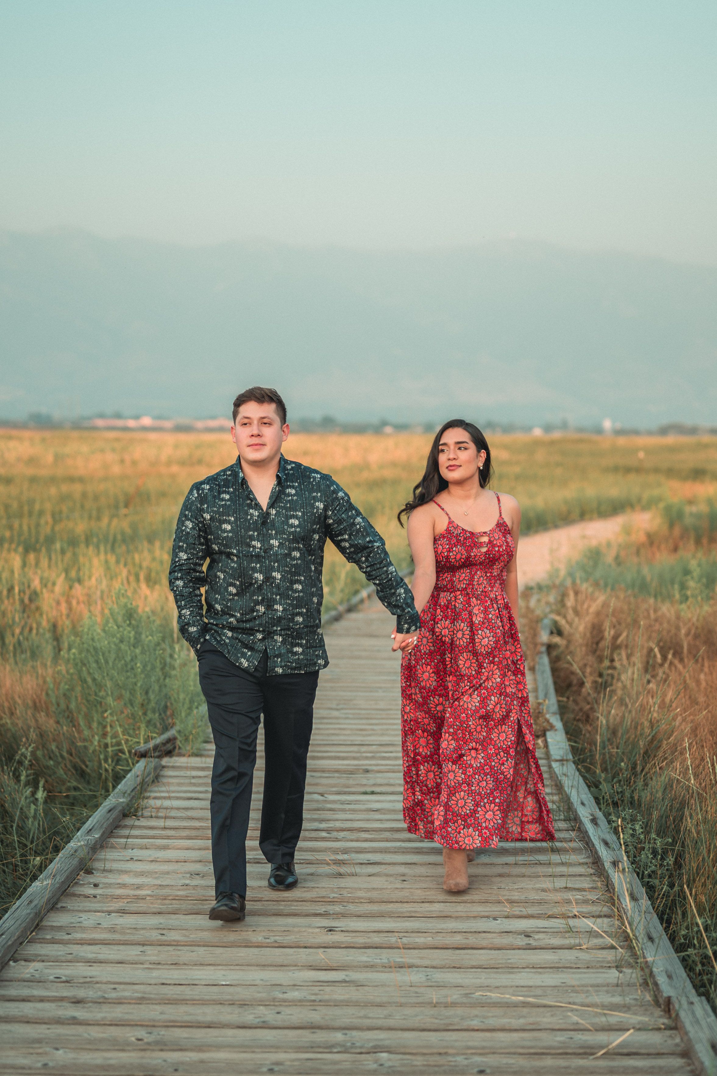 A Couple Walking while Holding Hands · Free Stock Photo