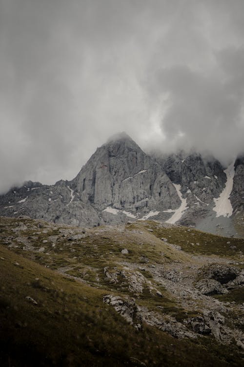 Gray Rocky Mountain Under the Cloudy Sky