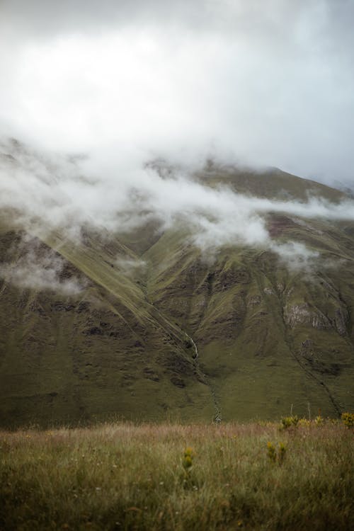 Low Clouds Covering Mountain Landscape 