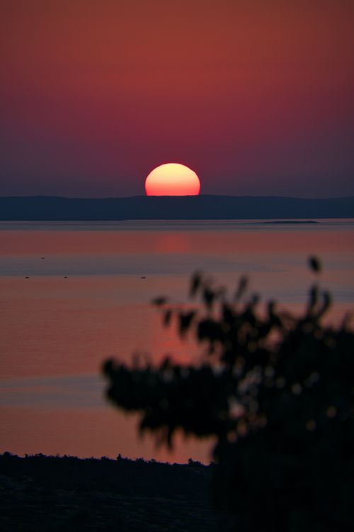 Free A mesmerizing sunset over the Adriatic Sea in Croatia with vivid colors reflecting on the water. Stock Photo