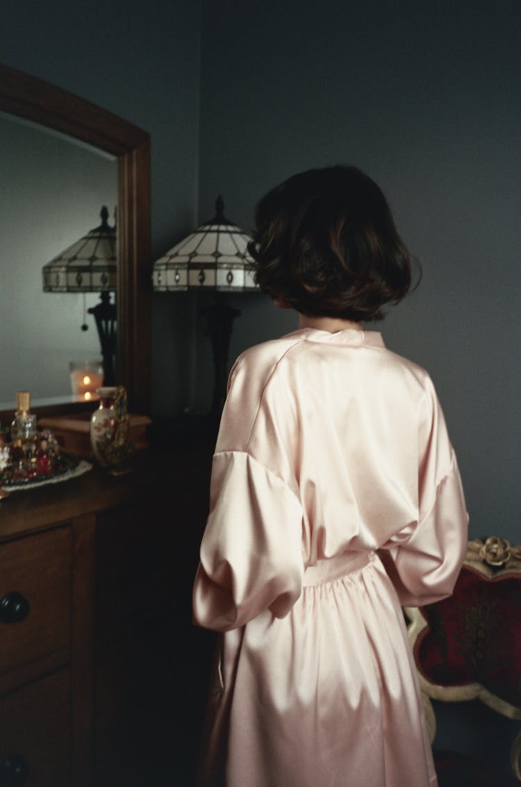 Backview Of Woman In A Satin Bathrobe 